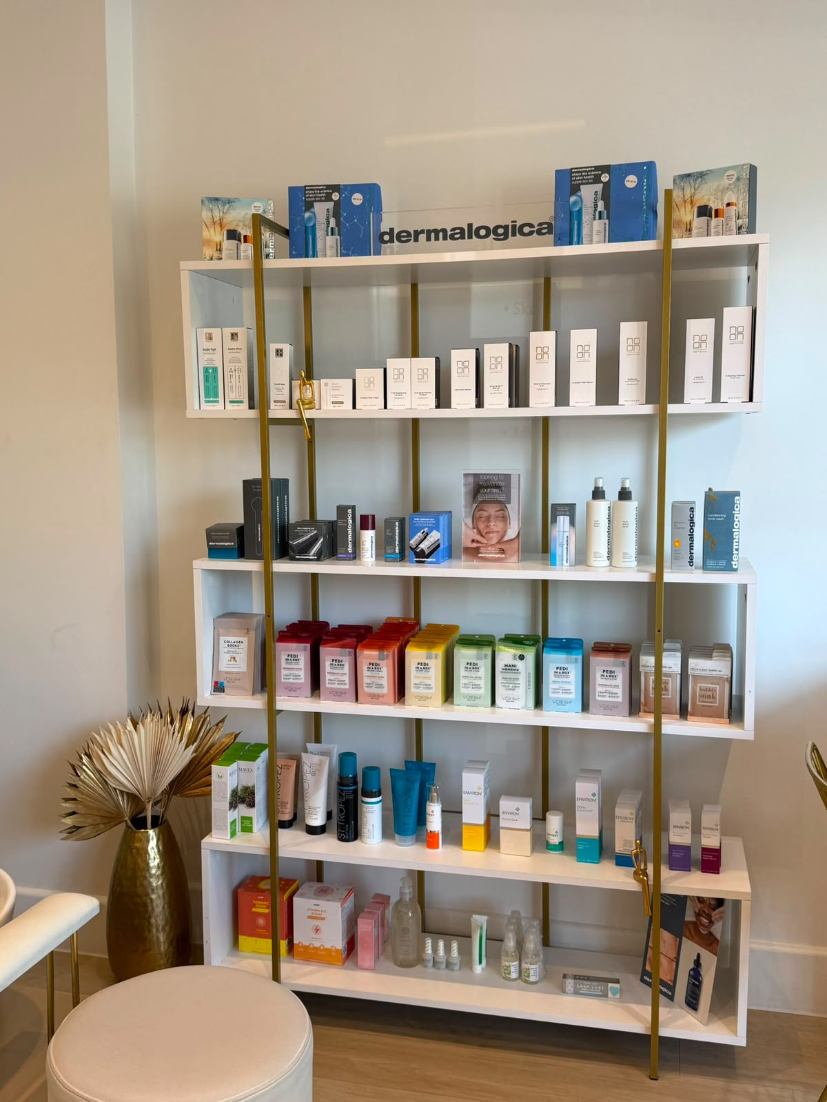 Dermalogica and Noon Aesthetics skincare retail shelving at Precious Moments Beauty Clinic, Banstead