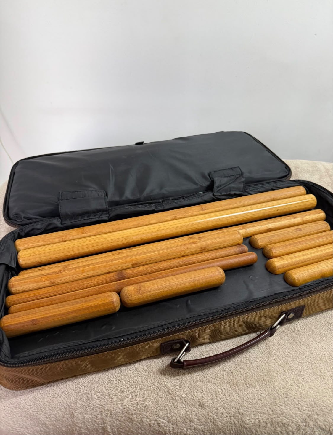 Anatomically-shaped wooden maderotherapy tools used for lymphatic drainage and body sculpting at Precious Moments Beauty Clinic, Banstead