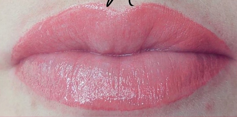 The same lips after lip blush semi-permanent make-up, with soft, even rose colour and a defined lip line