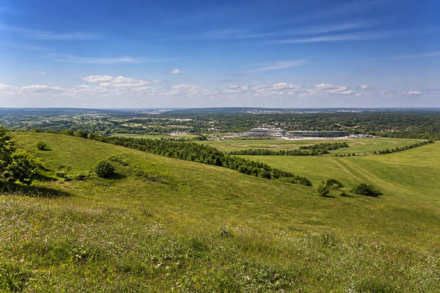 Epsom Downs Surrey, rolling green downland with a distant view of Epsom racecourse